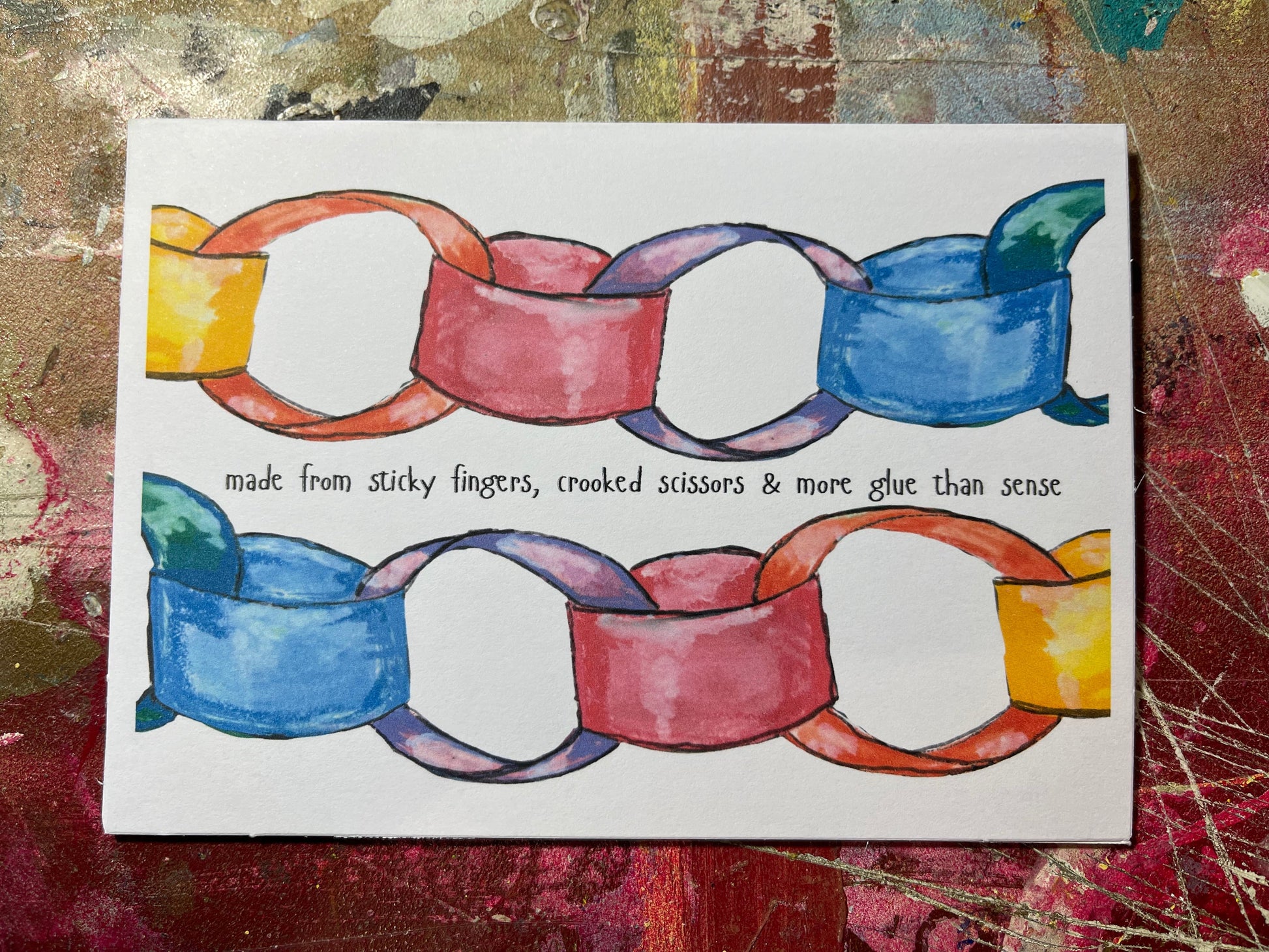 Colorful chain-like pattern on a textured background with text underneath.